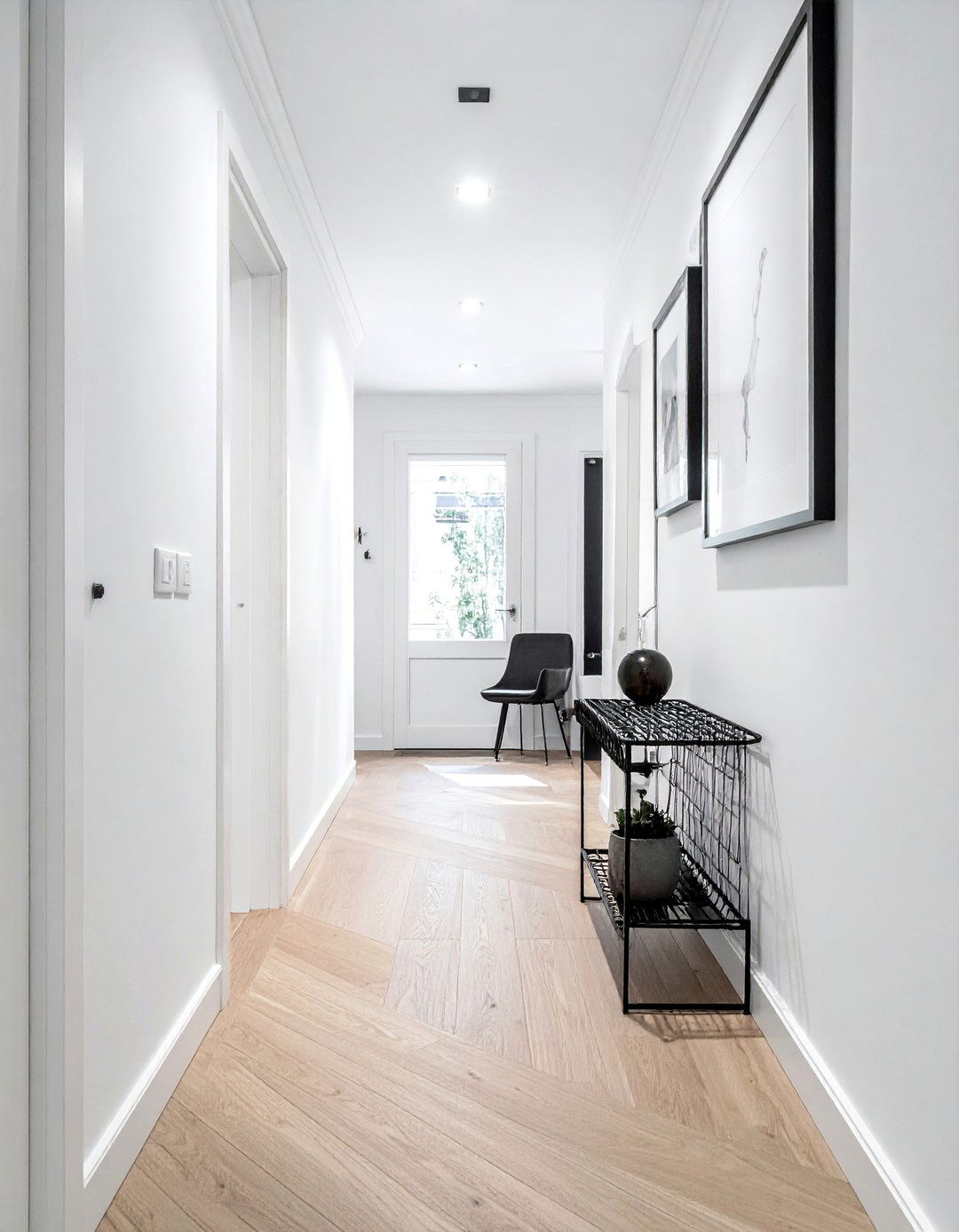 Scandinavian Inspired White Hallway with Black Decor - 20 Black and White Hallway Ideas for a Modern Look