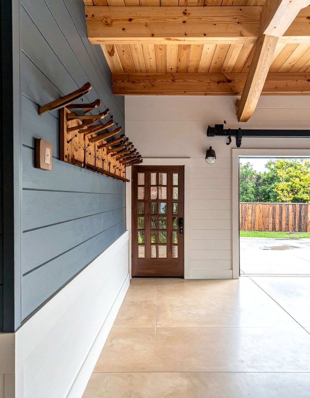 Shiplap Accent Wall With Peg Rail Hooks - 15 Garage Entryway Ideas for a Functional and Stylish Space