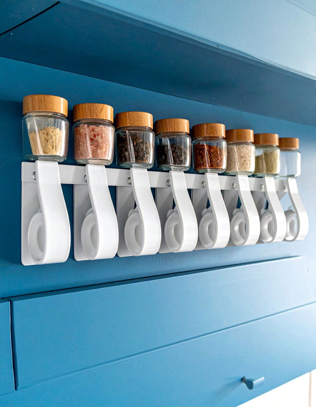 Spice Gripper Clips Inside a Cabinet Door - 40 Creative Spice Rack Ideas for Organized Kitchens