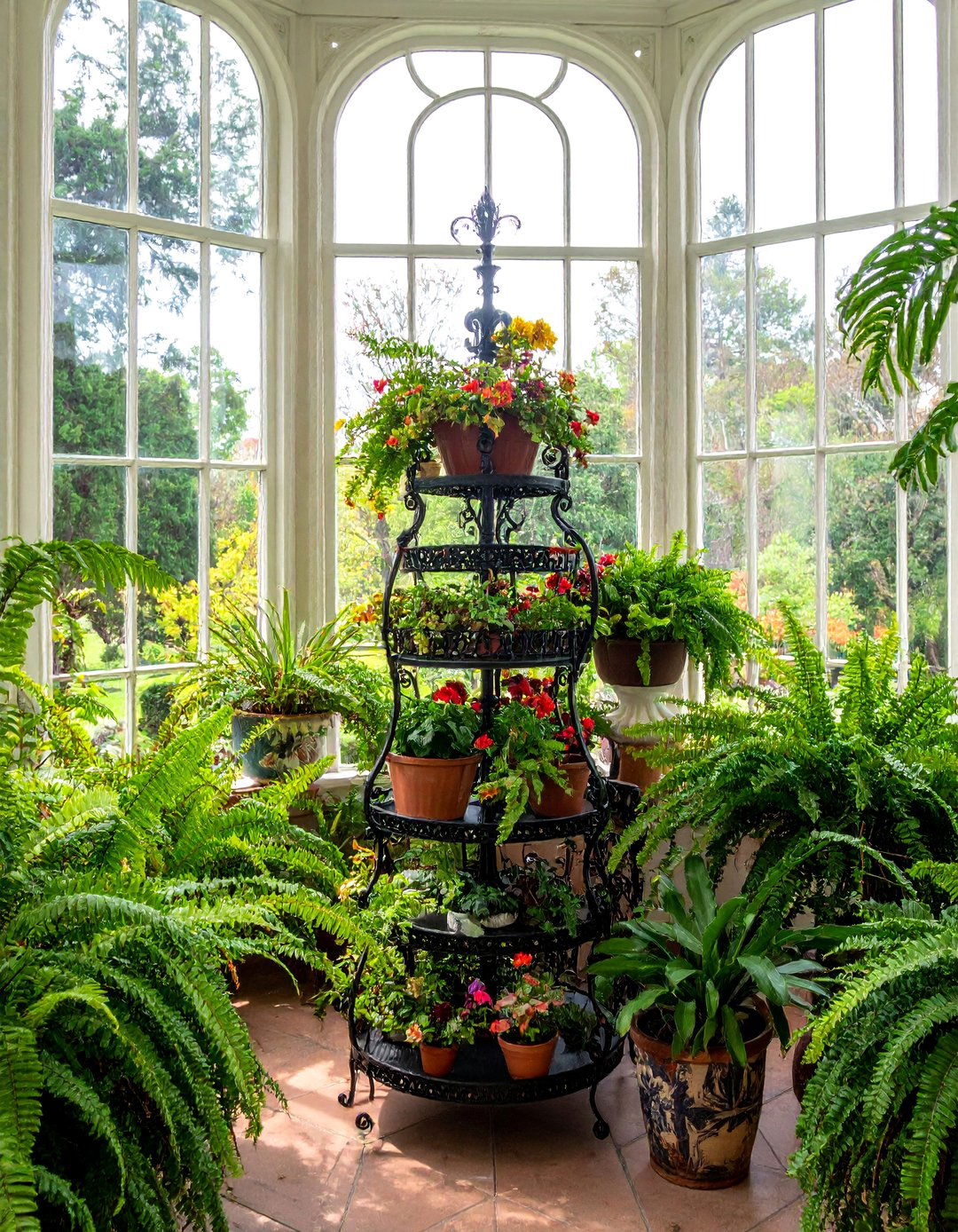 Victorian Sunroom Featuring Ornate Metal Plant Stands - 25 Victorian Sunroom Ideas for a Classic Retreat