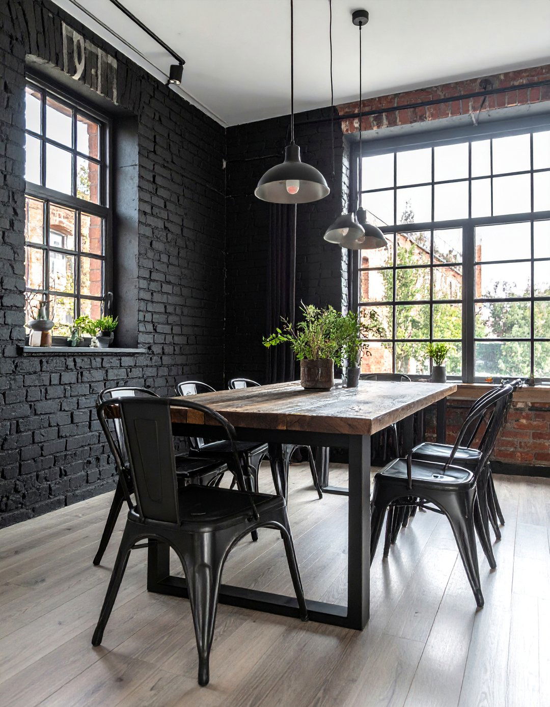 An Industrial Dining Room with a Black Brick Accent Wall